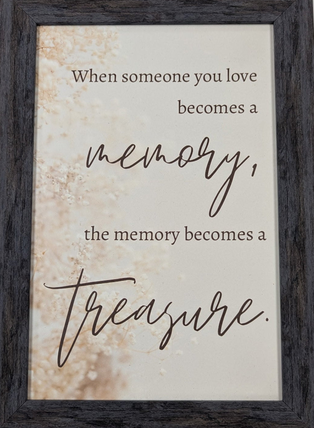 Framed print with a motivational quote on a light background