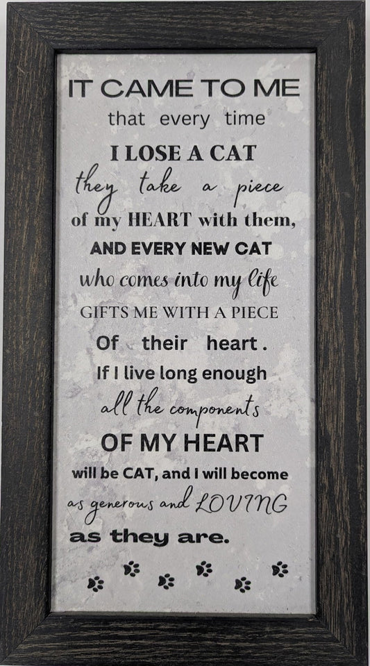 Framed text art on a gray background with a black frame