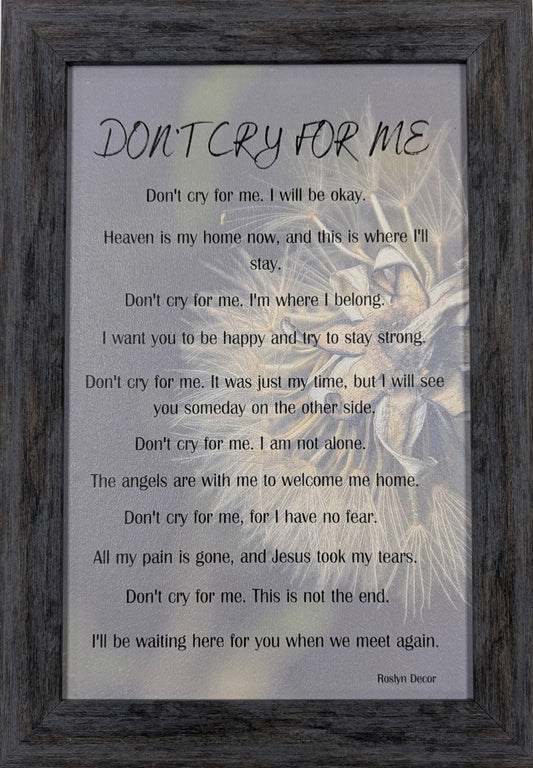 Framed artwork with text and a silhouette of a person against a gray background