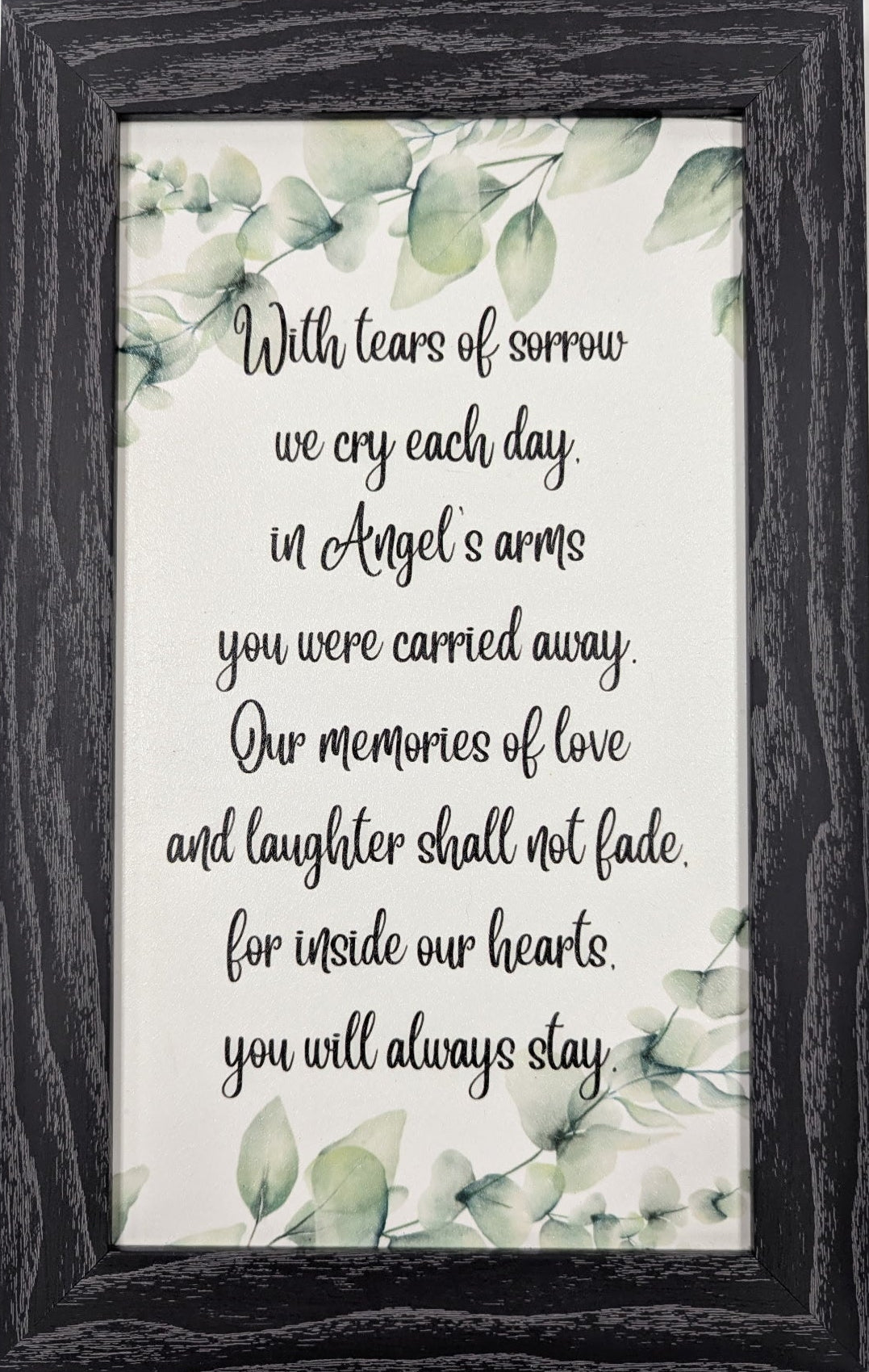 Framed print with a quote and floral design on a white background