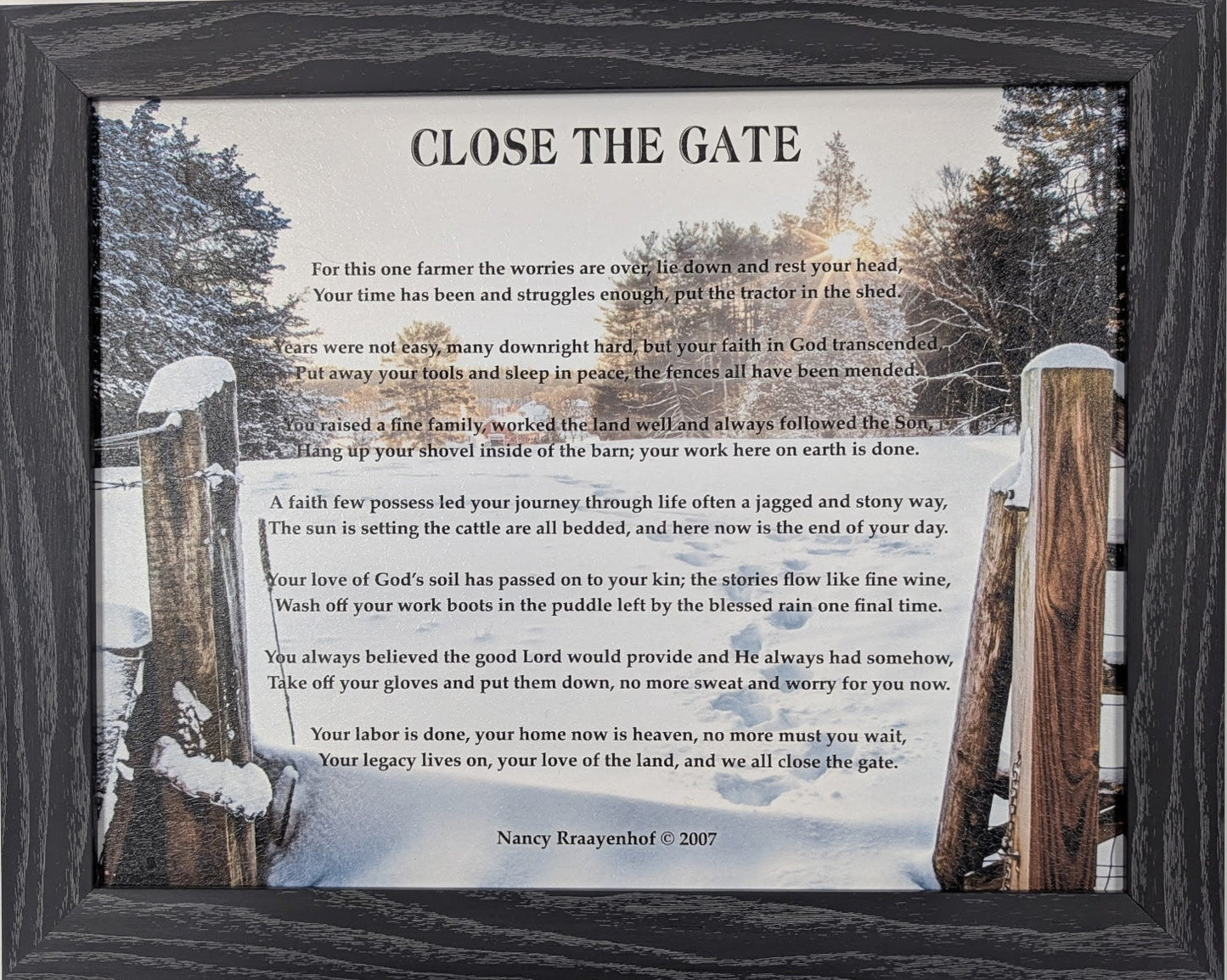 Framed print with a snowy landscape and text on a white wall