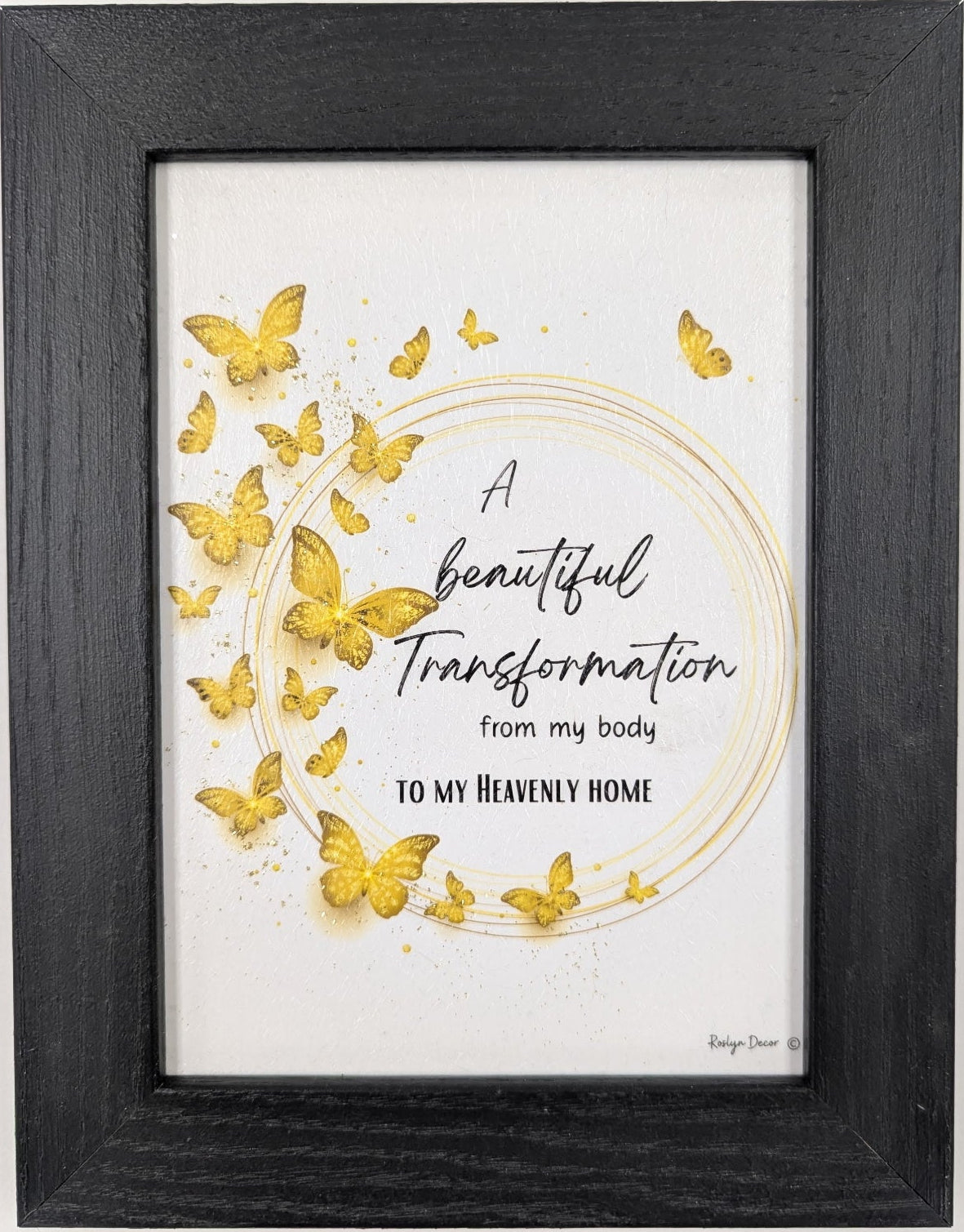 Framed artwork with yellow butterflies and text on a white background