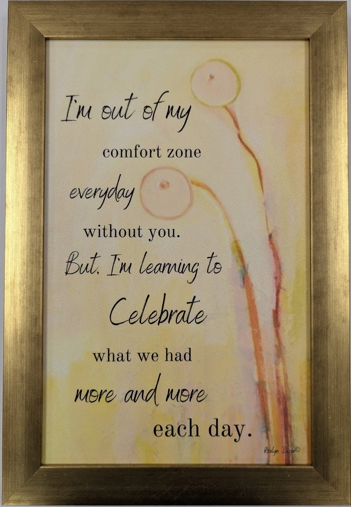 Framed artwork with a quote on a light background