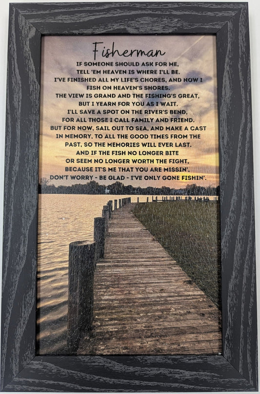 Framed artwork with a poem titled 'Fisherman' and a scenic view of a dock.