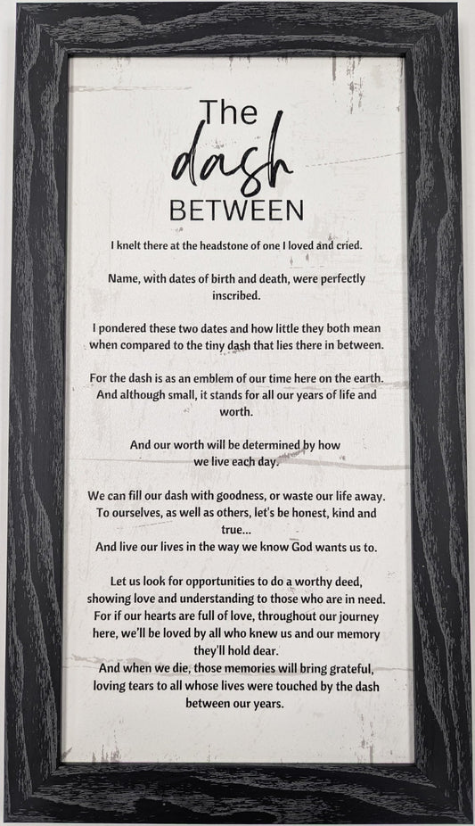 Framed print with 'The Dash Between' poem on a white background