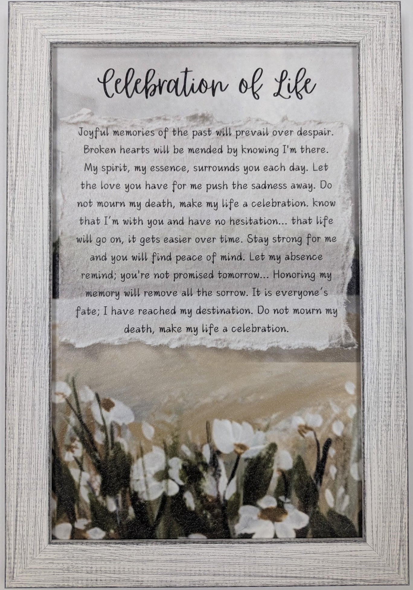 Framed text artwork titled 'Celebration of Life' with floral design at the bottom.
