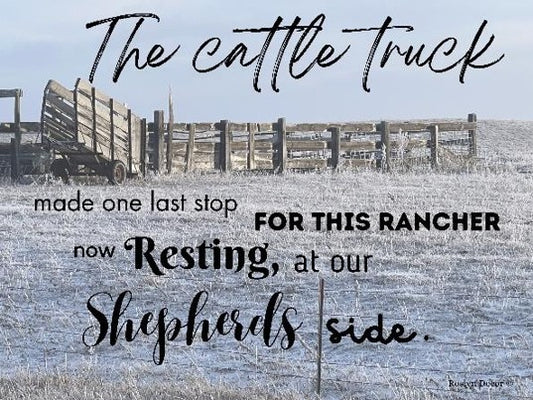 Rural scene with a wooden fence and text about a 'cattle truck' and 'rancher', with a blue sky.