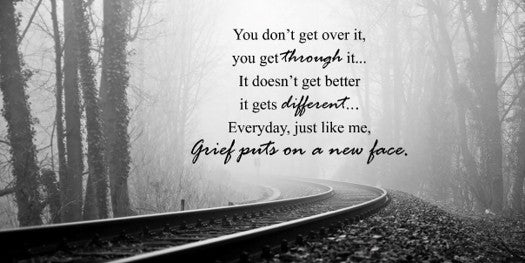 Foggy forest with railway track and inspirational quote about grief.
